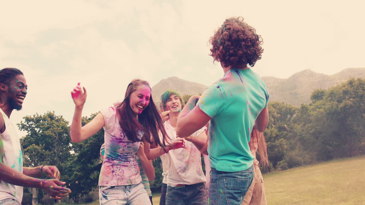Friends having fun with powder paint