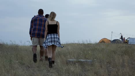 group of tourists walking on campsite