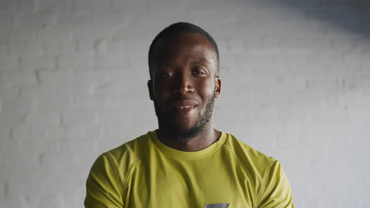 Portrait of man training in an urban setting taking a break