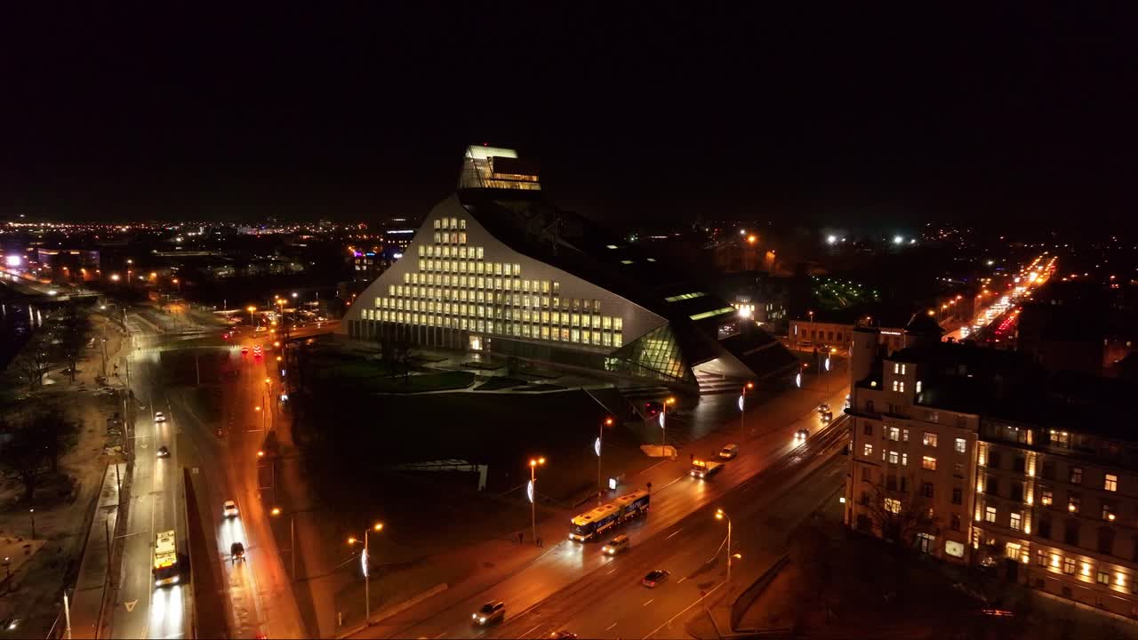 Aerial night view of illuminated National Library - vibrant streets, city lights