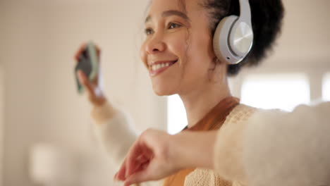 young woman, headphones and dancing in living