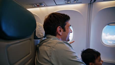 father and son enjoying an airplane flight
