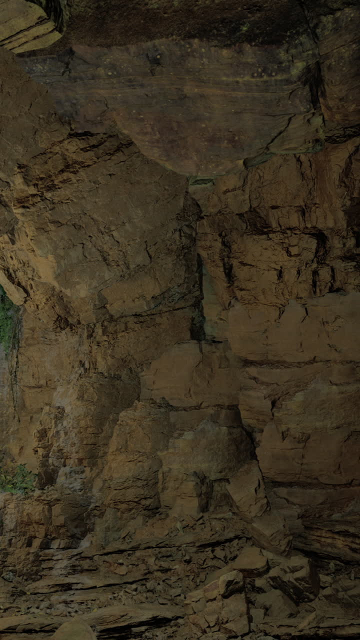 Exploring a vast cave with intricate rock formations and natural light