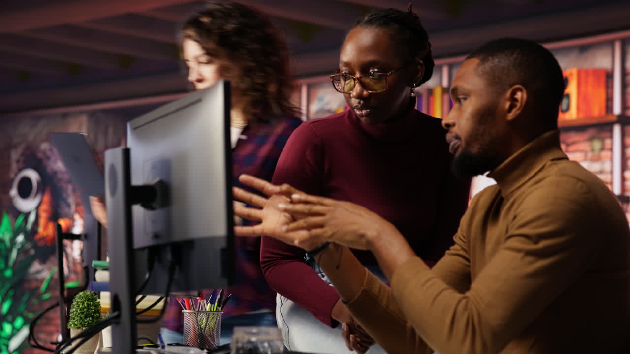 IT worker and colleague programming in AI startup office to build applications