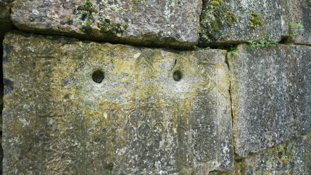 Panning from the left to right and back, showing some ancient designs on the wall of the religious site of the Alevian saint Demir Baba Teke, located in the province of Razgrad in Bulgaria.