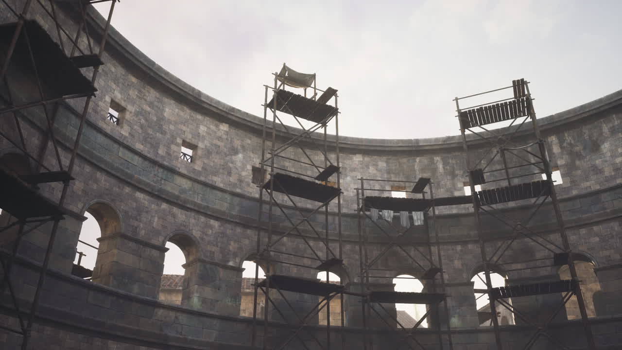 Restoration work inside an ancient amphitheater in progress during the day