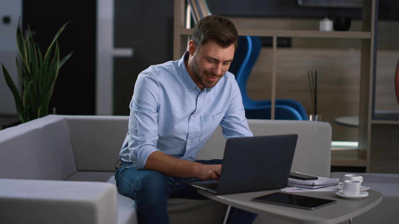 Focused business worker typing laptop digital device research data in workplace.