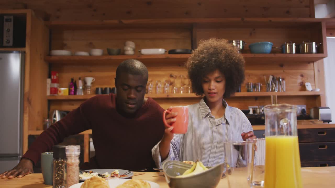 Couple having breakfast at home