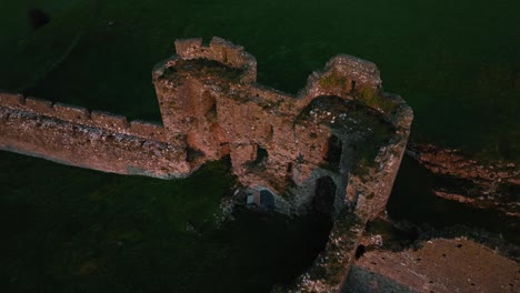 aerial views of an ancient castle ruins at sunset