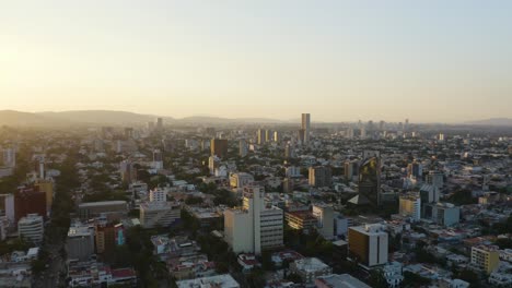 backward aerial flight reveals guadalajara, mexico city