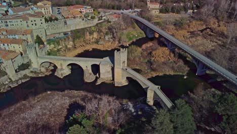 besalu town in girona, spain featuring ancient bridges and scenic landscape, aerial view