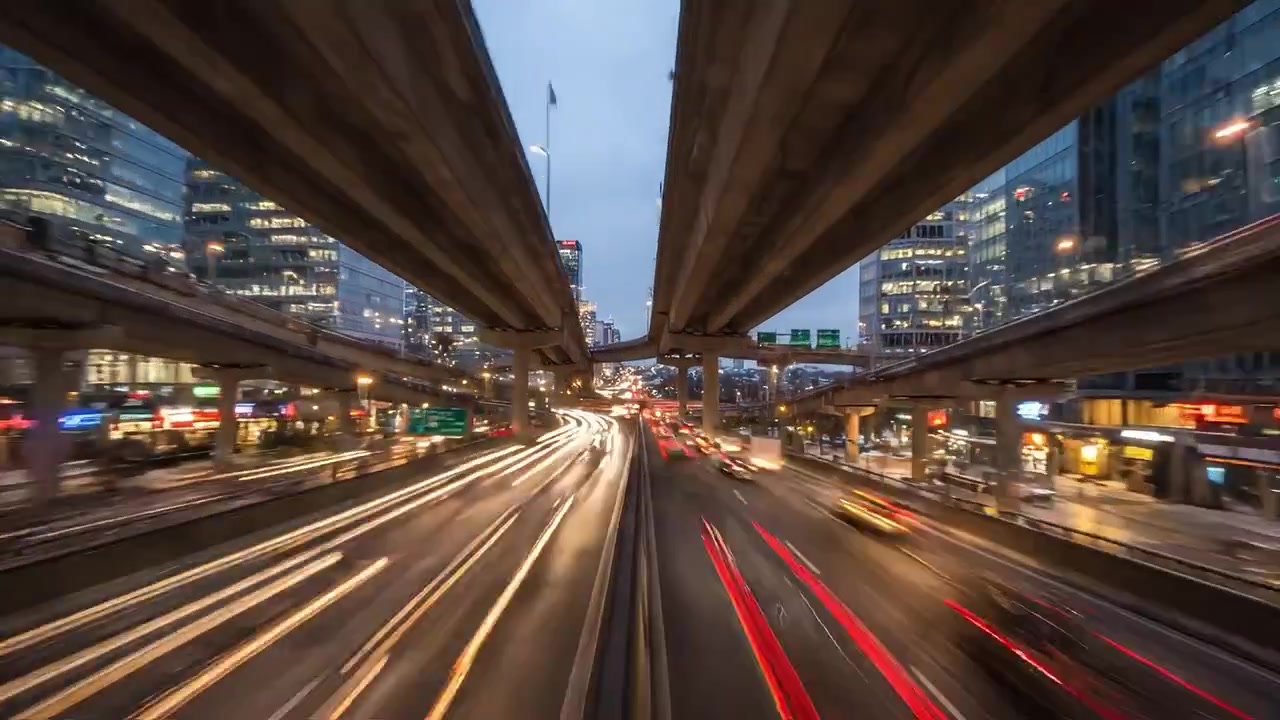 Stunning Transition from Serene Winter Landscape at Sunset to Vibrant Urban Nightlife with Flowing Traffic Amidst Snowy City Scenery