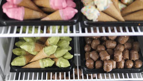 miniature organic ice cream cones in various delicious in bakery fridge freezer