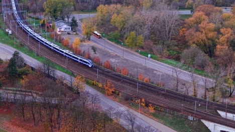 aerial view of train on railway tracks in autumn