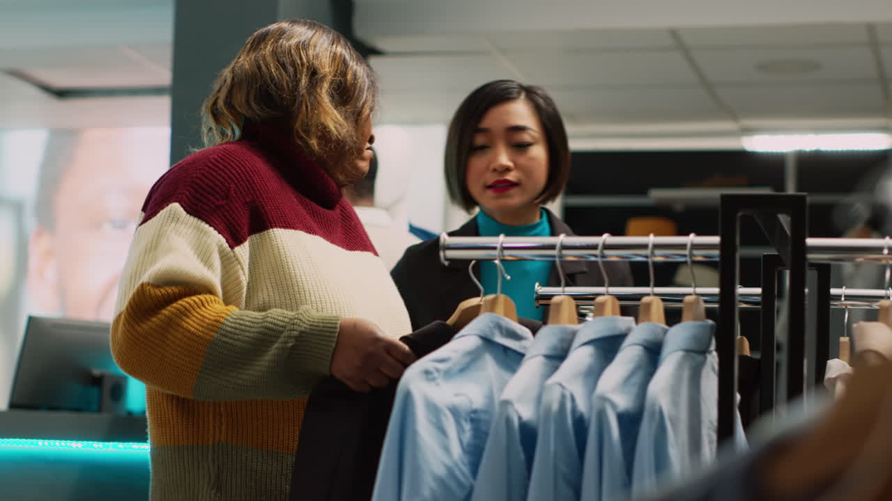 People Shopping for Clothes in Retail Store