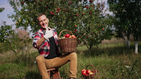 happy farmer with a basket of apples