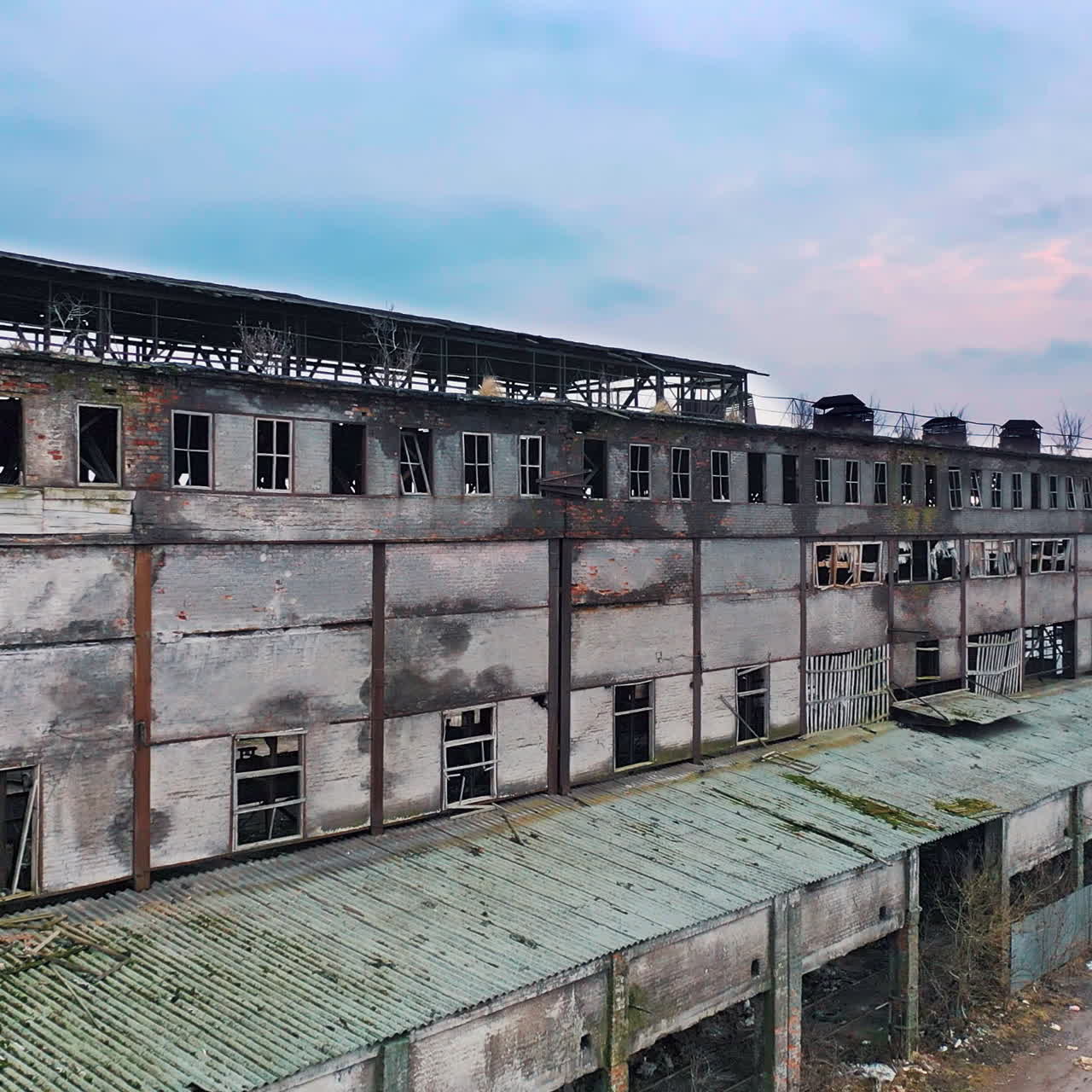 Aerial view from the air to an abandoned factory. Old industrial building for demolition.