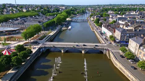 aerial top-down view over mayenne shows fountains, the 11 novembre square, riversides, and a calm bridge under sunligh - france