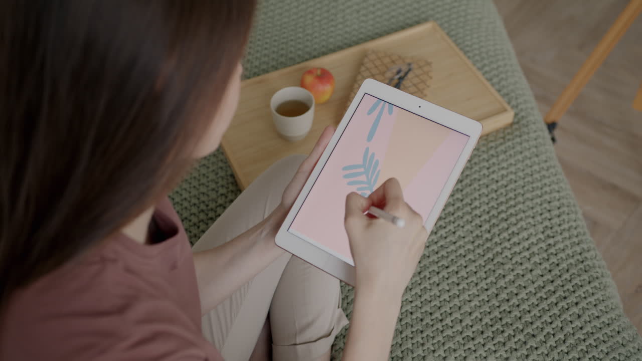 Woman Drawing on Tablet