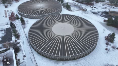 aerial pushing towards a large above ground water reservoir during the winter