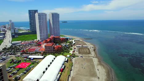 Aerial-view-of-Boca-del-Rio,-Veracruz-beach-showing-a-resort-and-residential-buildings