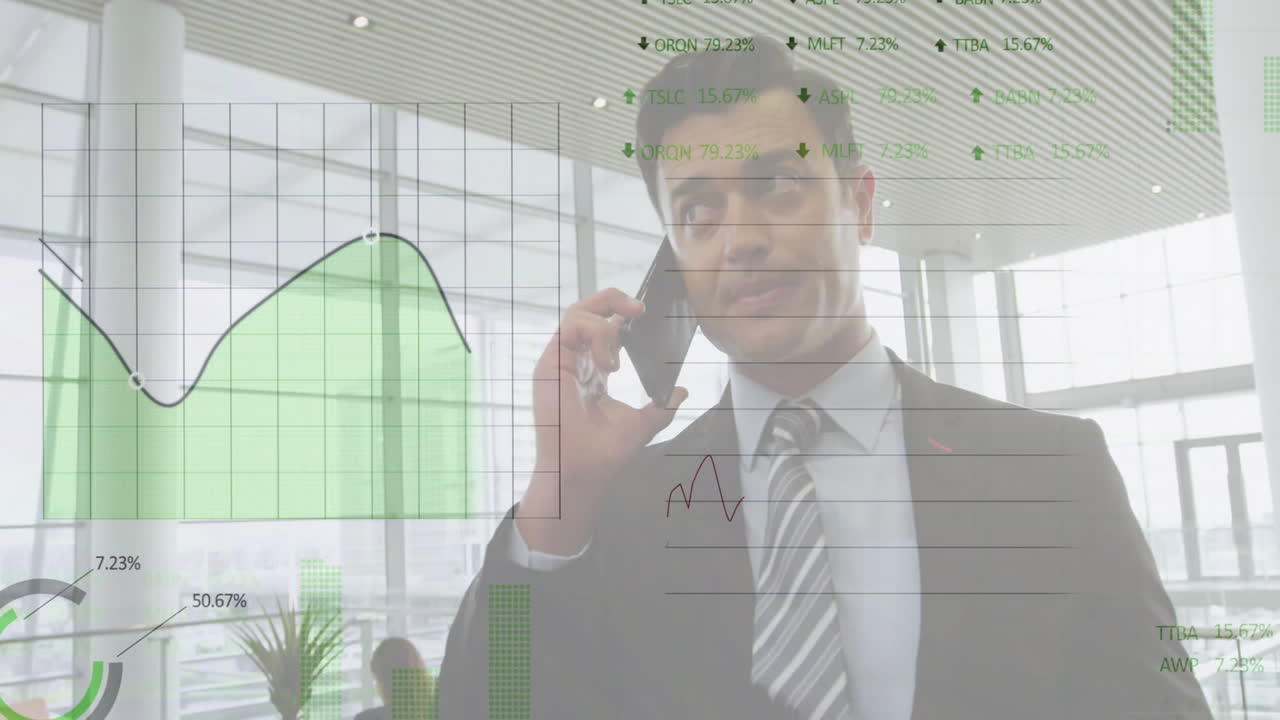 Male businessperson talking on smartphone in business lounge, displaying animated financial charts