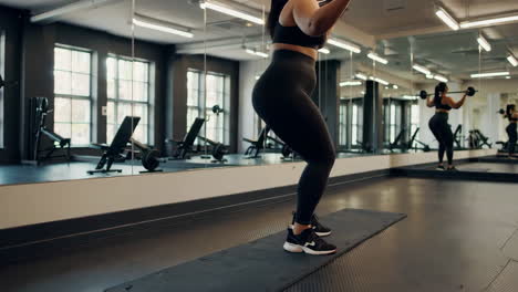 woman weightlifting in gym