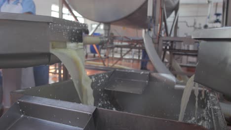 Liquid-milk-is-flowed-into-the-mixer-machine-at-the-cheese-factory