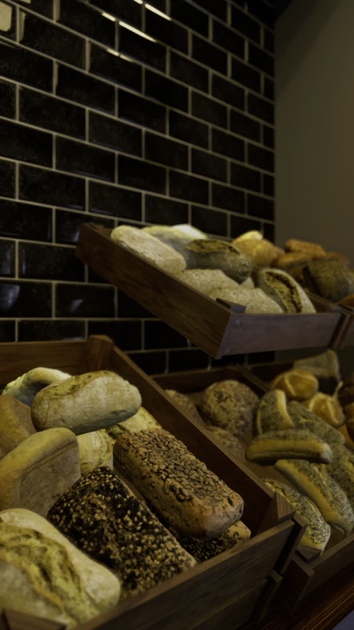 Freshly baked bread displayed in wooden crates in a cozy bakery