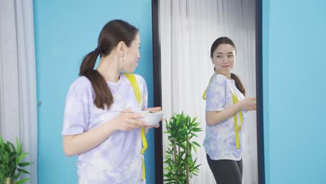 healthy diet. the woman consumes vegetables to stay fit and fit.