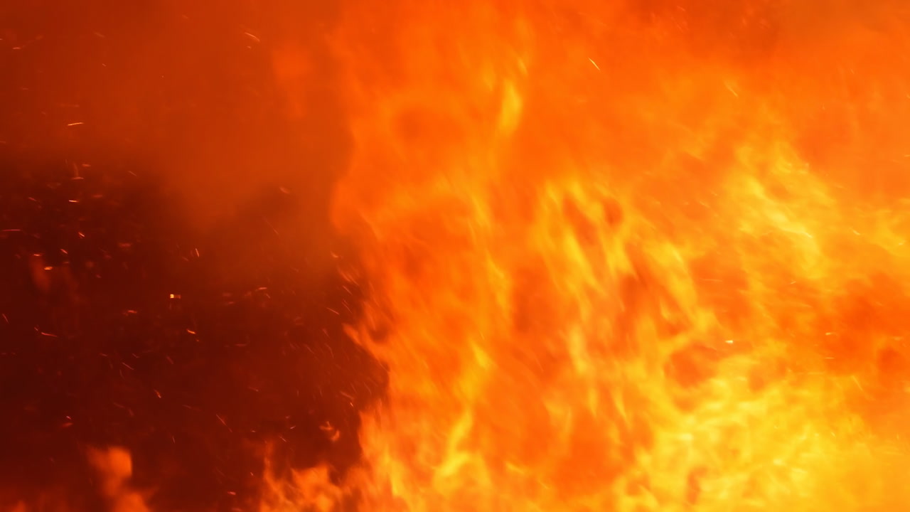 Intense Closeup Of Roaring Flames, Thick Orange Fire And Flying Embers, Turbulent Tongues Of Heat And Heavy