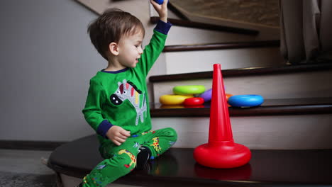 playing with colorful toys. playful small boy indoor.