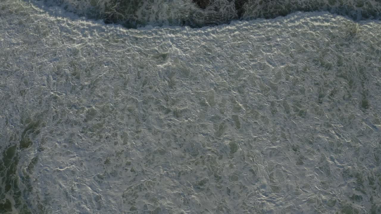 Waves Flowting through the ocean in Portugal from the bird view