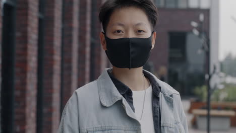 person wearing a mask in the city