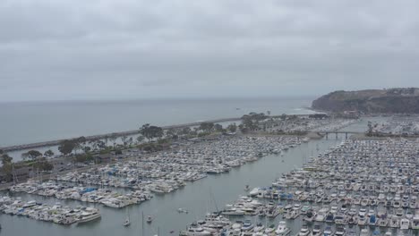 A-stunning-aerial-drone-shot,-flying-over-Dana-Point-Harbor,-Dana-Point---Orange-County---California