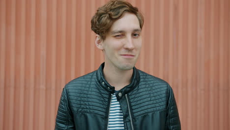 smiling man in leather jacket