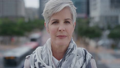 portrait beautiful senior woman turns head looking confident middle aged female enjoying successful urban lifestyle in city slow motion aging beauty