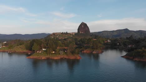 aerial drone shot of guatape lake in the mountains of colombia during the day