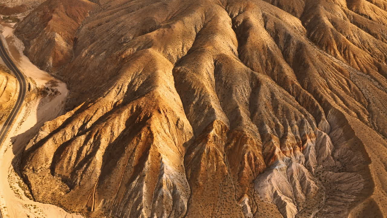 Amazing rock formations with no plants growing on. Drone approaching mountains in Nevada, USA.