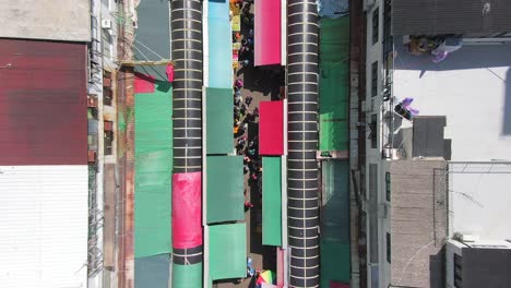 ngau chi wan wet market rooftops, downtown hong kong with fresh meat and fish stalls, top down aerial pass
