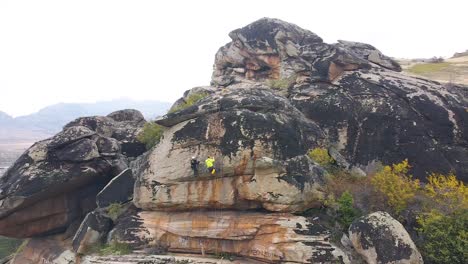 climbers climbing a big vertical rock