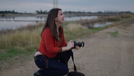 woman taking pictures in the countryside