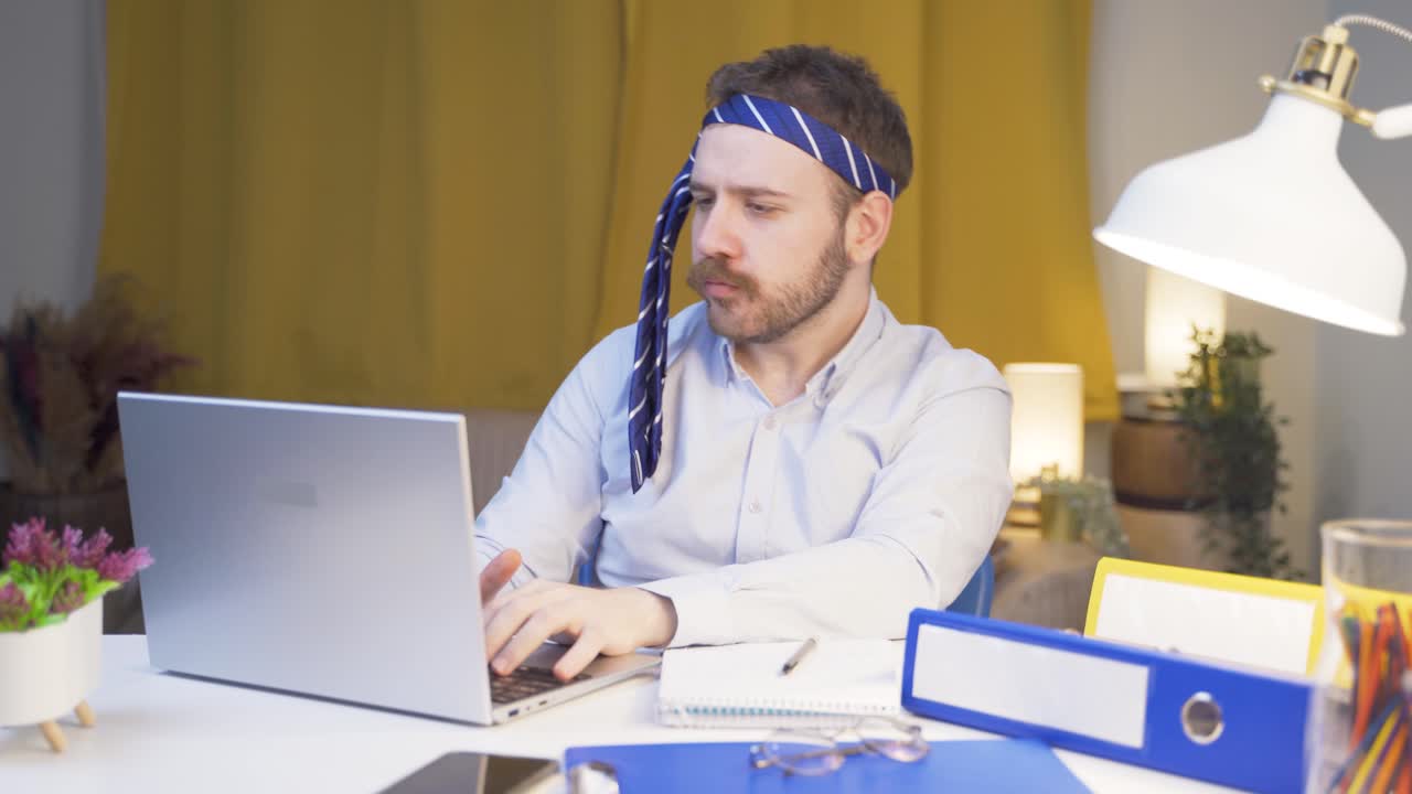 Home office worker man is fun and cheerful.