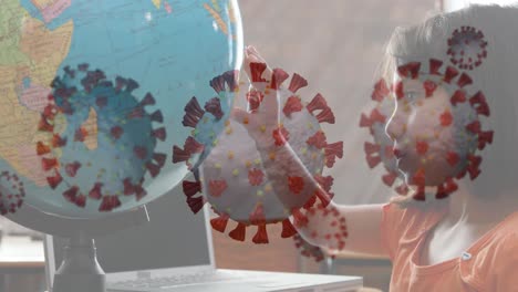 coronavirus cells spreading over school child playing with globe.