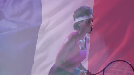 animation of flag of france over african american female tennis player with tennis racket