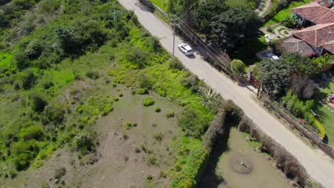 Prepare-to-embark-on-a-captivating-aerial-adventure-over-the-enchanting-colonial-houses-of-Villa-de-Leyva,-Yaw-left-with-gimbal-move