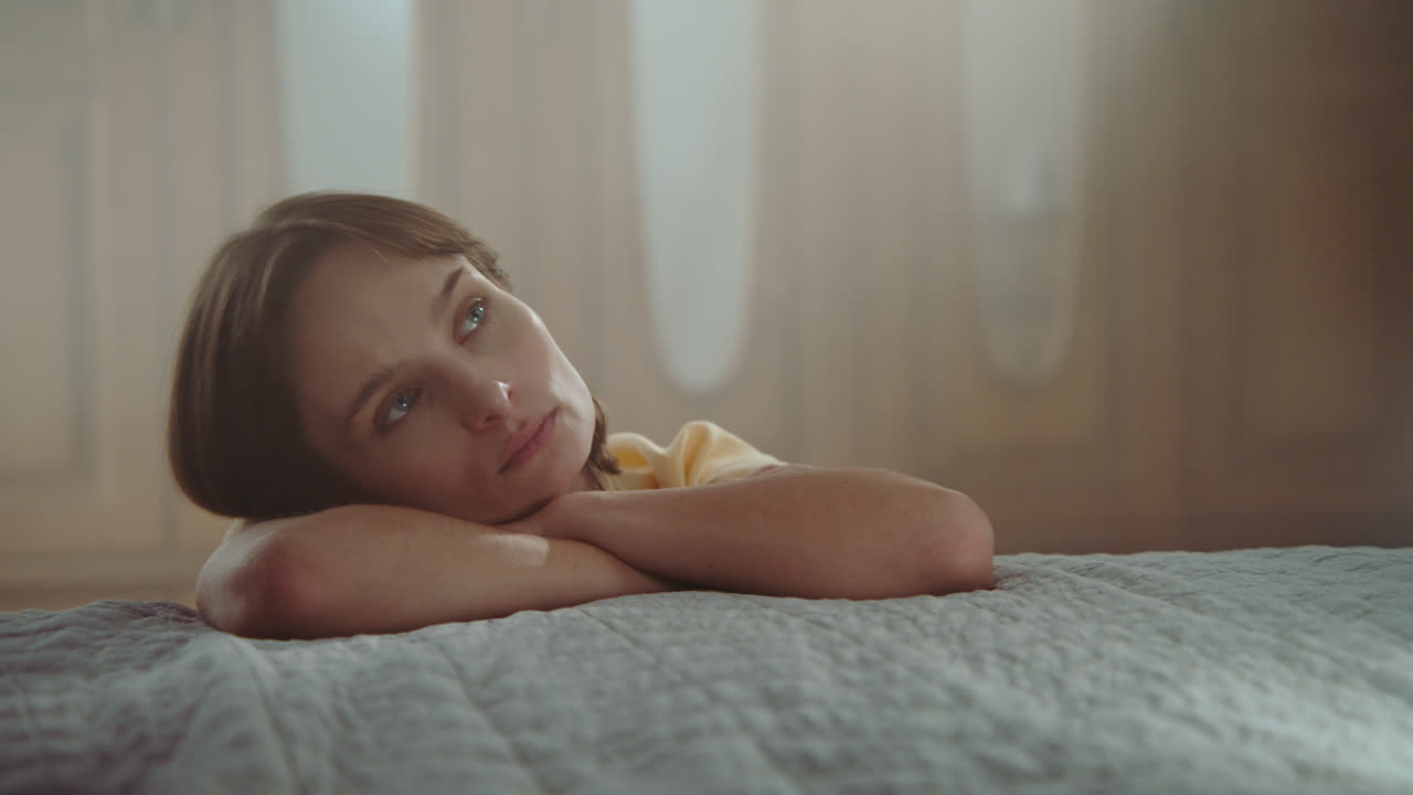 A girl playing with dolls in her room