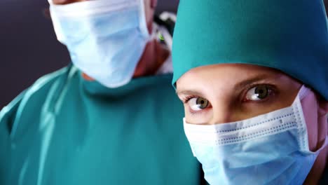 portrait of female surgeon standing in a operating room