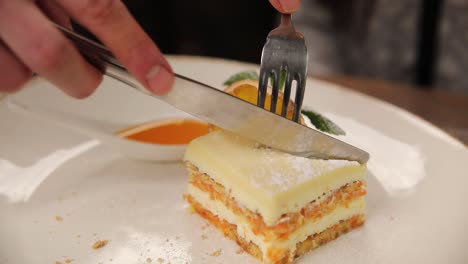 cutting a piece of carrot cake