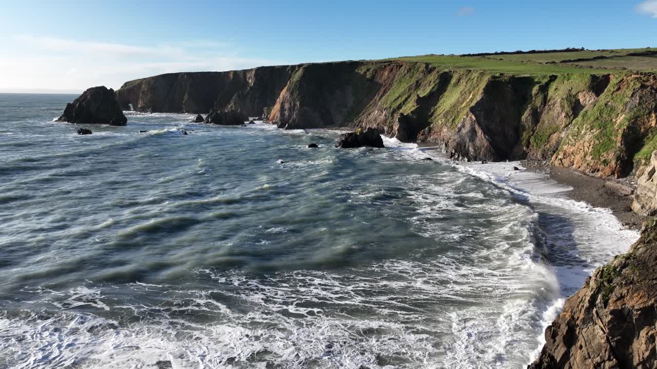 Epic Ireland wild nature large waves and swell pound sea cliffs Copper Coast Waterford winter storm